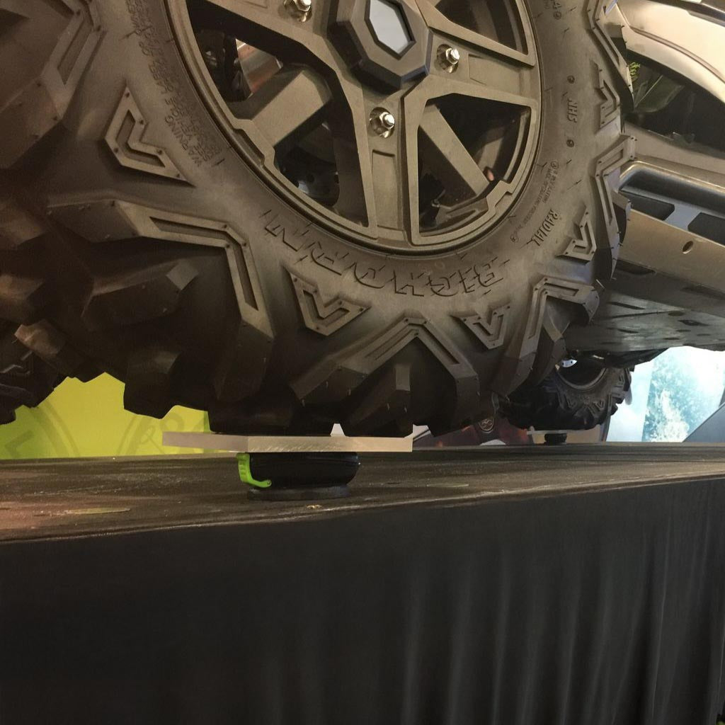 Polaris RZR tires resting on multiple Popticals hardshell cases