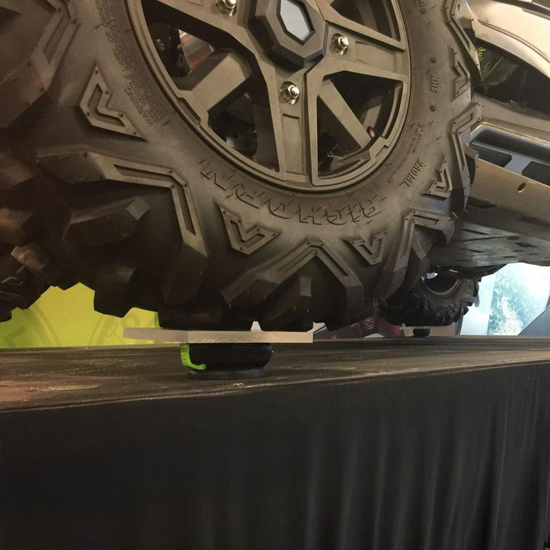 Polaris RZR tires resting on multiple Popticals hardshell cases